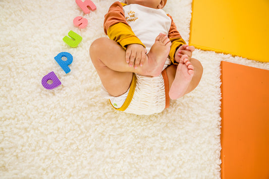 apushi-vetementbebe-genou-os-corps-bebe